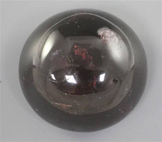 A Chinese red gem stone cabochon shaped scroll weight, diameter 5.1cm